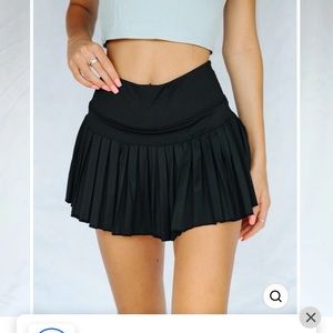 Black pleated tennis skirt from GoldHinge Large